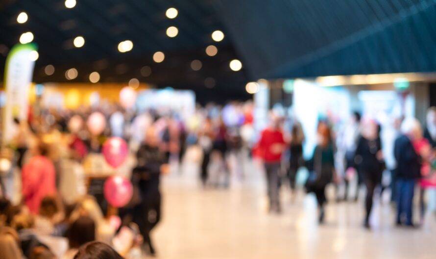 Blurred crowd of people in modern interior during event